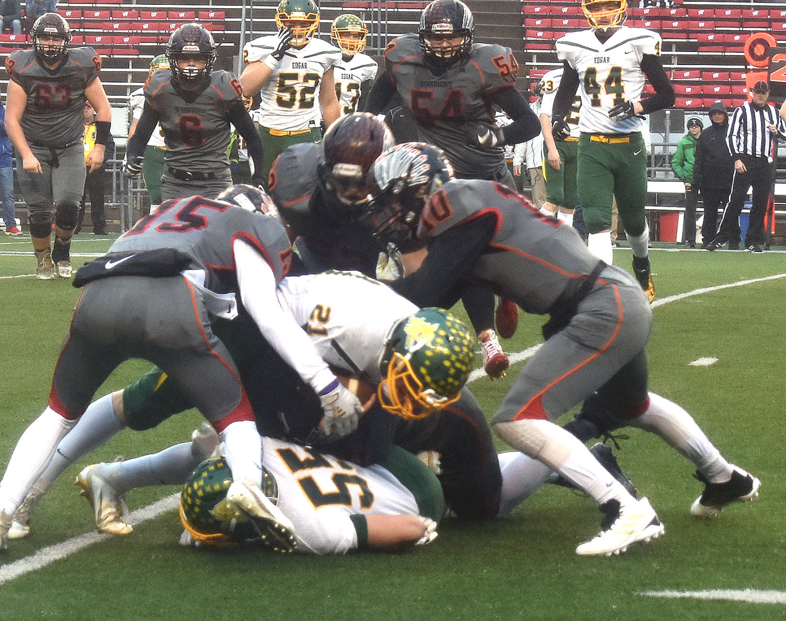 WIAA state football photo: Black Hawk defenders stop Edgar's Kaleb Hafferman